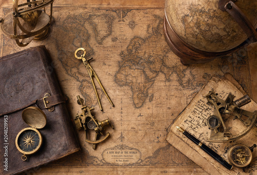 Konstfotografi Vintage map on aged paper with antique navigation instruments like a brass sexta