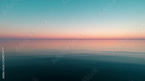 Calm ocean at sunset horizon.