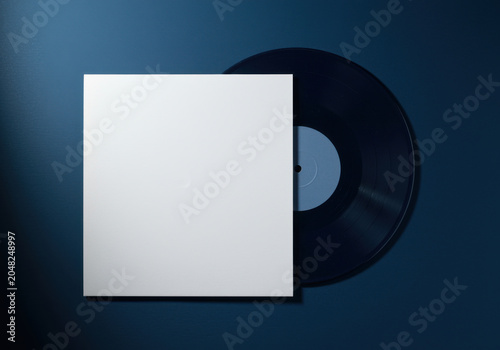 White square paper sleeve with black vinyl record disc on blue background for music album branding, audio industry mockup and minimalist sound design template