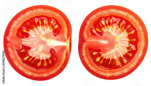 Sliced red fruit, bisected, revealing juicy pulp, seeds, and vibrant interior against a black background