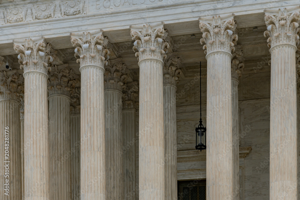 Obraz premium Columns stone architectural perspective layout. Columns marble symmetry repetition. Columns decorative capitals carved detail. Columns facade.