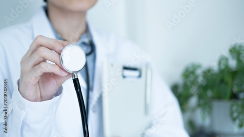 Konstfotografi Healthcare professional holding stethoscope with clipboard in hospital clinic, health checkup, patient care and preventive examination concept