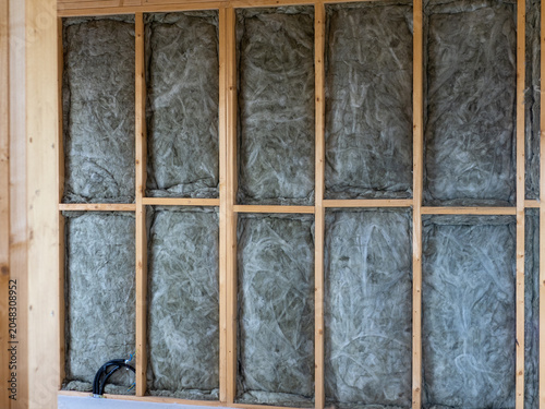 Lightweight timber frame structure with rock wool insulation between the beams. Energy-efficient new build house