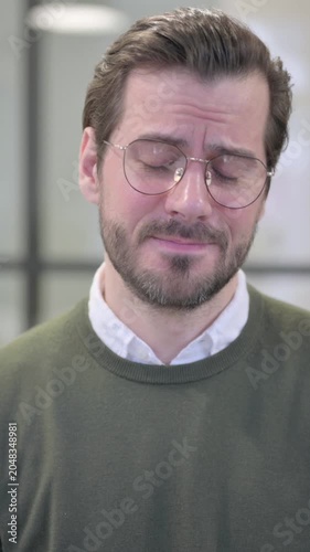 Portrait of Young Businessman Looking at the Camera, Sad Expression, Vertical Video