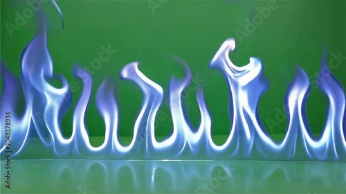 Electric blue flames dancing on reflective green surface with neon glow effect