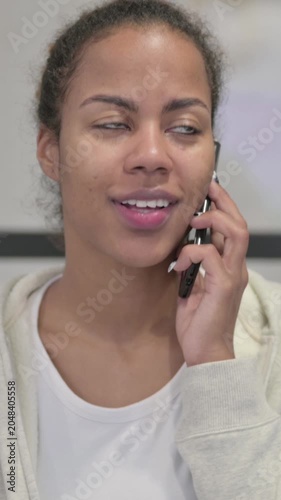 Busy African Woman Talking on Smartphone, Vertical Video