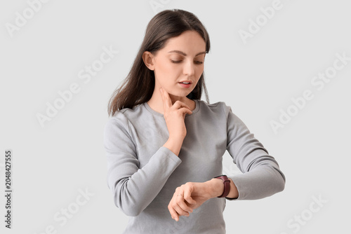 Young woman with wristwatch...