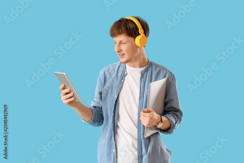 Young man in headphones wit...
