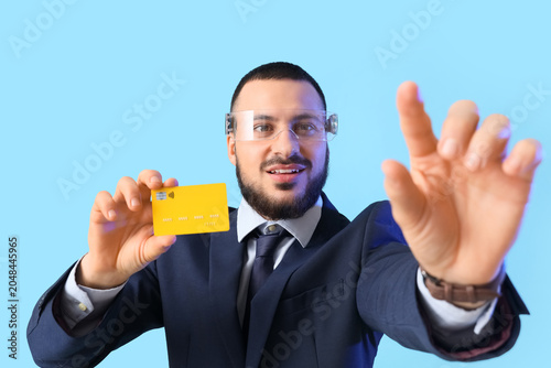 Young businessman in AR gla...
