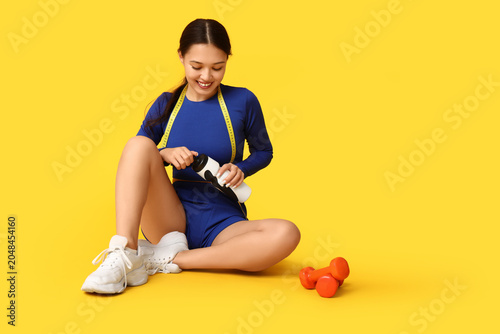 Young woman in sportswear, ...