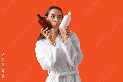 Thoughtful young woman in b...
