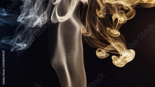 Abstract swirling smoke wisps against a dark background in an artistic composition