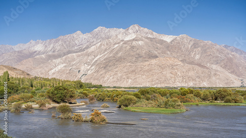 Scenic landscape view of Panj river valley and Wakhan mountain range in Wakhan Corridor near Langar, Ishkashim, Gorno-Badakhshan, Tajikistan Pamir