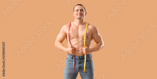 Male bodybuilder with measu...