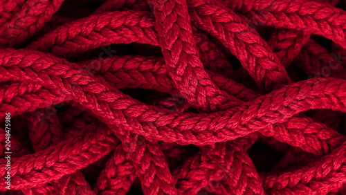 Canvastavla Close-up view of a tangled heap of thick, braided red rope, showing the intricat