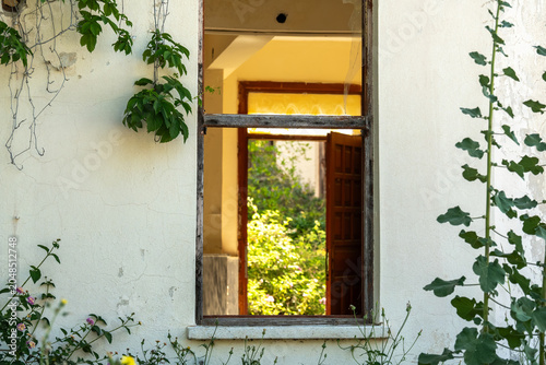 Photos An abandoned overgrown hotel braided with beautiful flowering plants