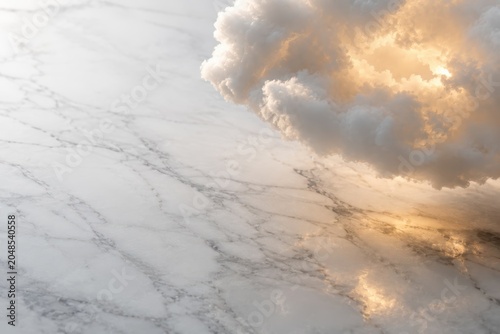 Surreal Composition of a Luminous Golden Cloud Floating Above Polished White Carrara Marble with Negative Space