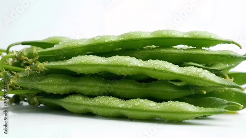 Fresh raw okra pods on white background minimalist close-up still life
