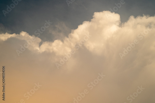 Soft white clouds against a gradient sky at sunset.