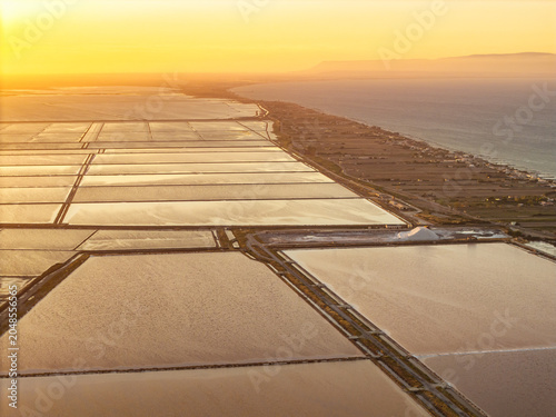 Photos Aerial view of the Margherita di Savoia salt mines at sunset in Puglia, Italy