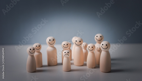 Foto Wooden figures stand in soft light
