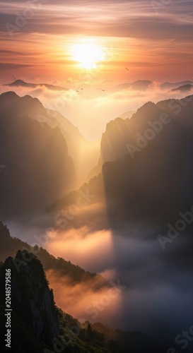 Spectacular Sunrise Over Mountain Peaks and Misty Valley Landscape.