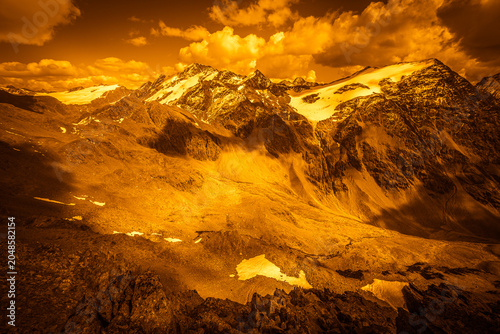 Foto Fantasy effect color of alpine panorama with majestic peaks surrounded by glaciers, Planol Valley, Alto Adige - Sudtirol, Italy