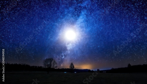 Celestial Symphony - A Night Sky Illuminated by Stars and Moonlight.