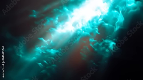Dramatic teal light rays shining through dense clouds abstract background