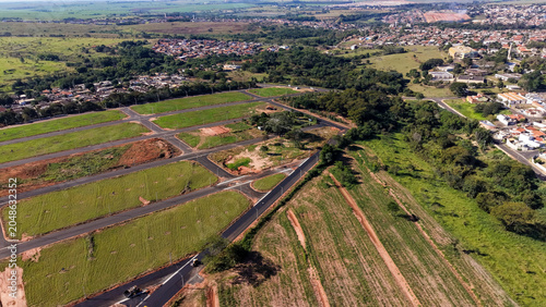 Obraz na płótnie Aerial view of a new housing development with cleared land and roads under const
