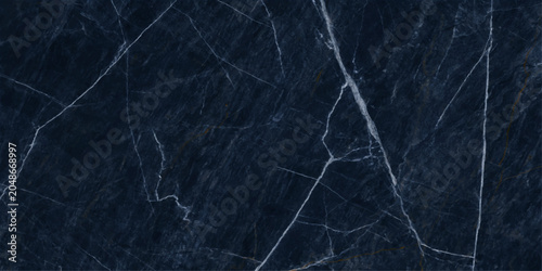 Valokuva Dark blue marble with intricate white veins, showcasing a natural, luxurious texture with a sophisticated finish