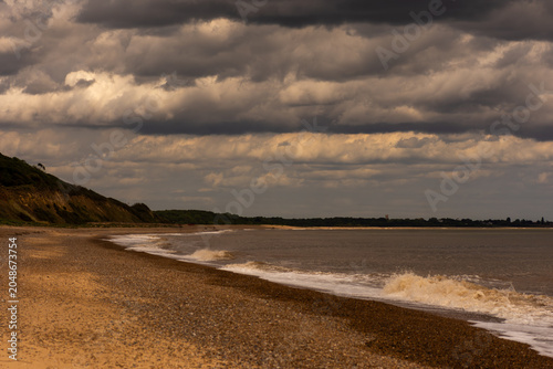 Φωτογραφία Dunwich Beach Under a Stormy Sky, Suffolk Coast, England