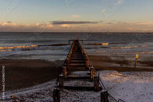 Fotografie Snow-Covered sea groynes at Lowestoft Beach, Suffolk Coast
