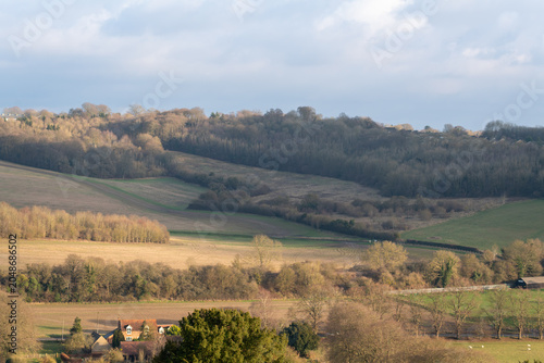 Valokuva Winter sunlight on Chilterns escarpment with farmhouse and ploughed fields, Buck