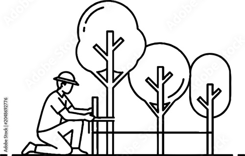 Gardener planting and supporting young tree saplings outdoors.