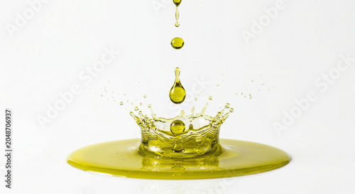 Drops of cold pressed olive oil in motion