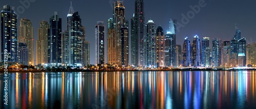 City Skyline Reflections At Night Over Water