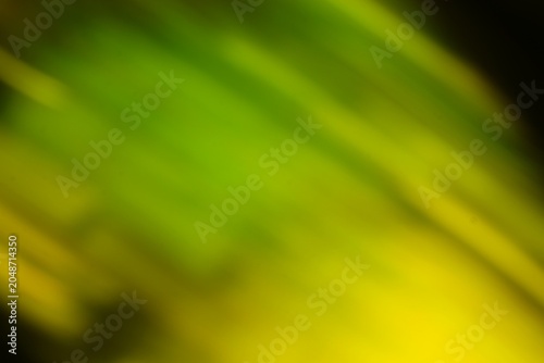 Abstract green and yellow blurred background with dynamic motion effect suitable for nature and