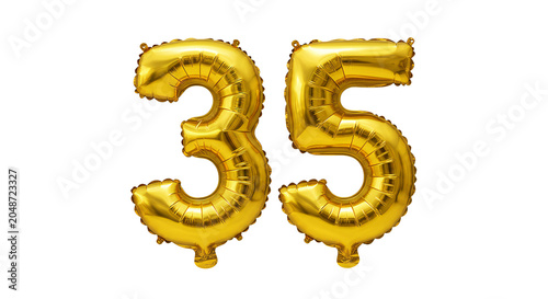 Golden balloons shaped like the numbers thirty five float freely
