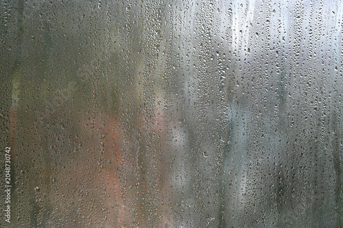 Photography Glass with countless water droplets forms atmospheric backdrop