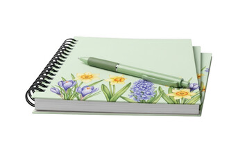 Spiral bound notebook with floral border and pen resting on cover for creative planning