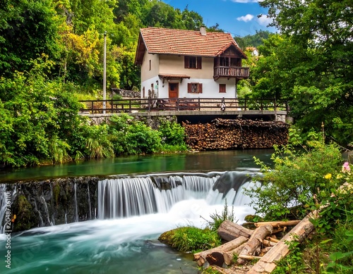 Charming two story house with waterfall garden view.