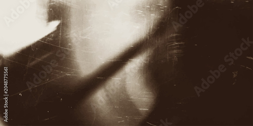 Foto A mysterious and haunting sepia-toned image depicting a ghostly silhouette of a person with a haunting gaze, evoking a sense of unease and the supernatural