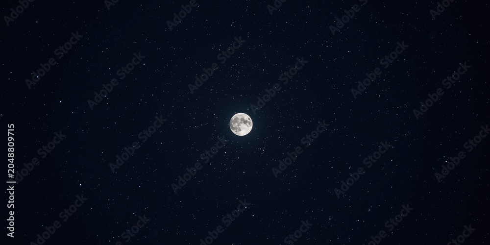 Obraz premium Moon glowing intensely in a crystal clear star-studded night sky