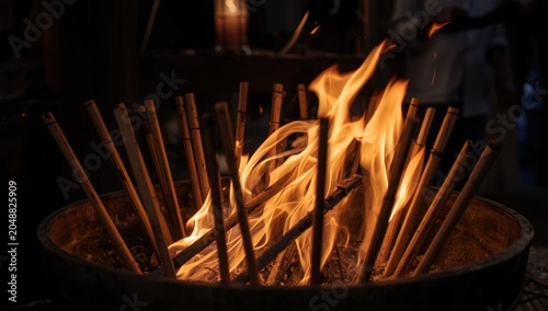 Joss paper sticks flame and ash during traditional observance