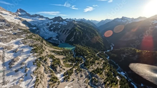 Aerial View of Mountain Range with Glacier Lake and Valley for Outdoor Adventure Travel & Nature Exploration Backgrounds