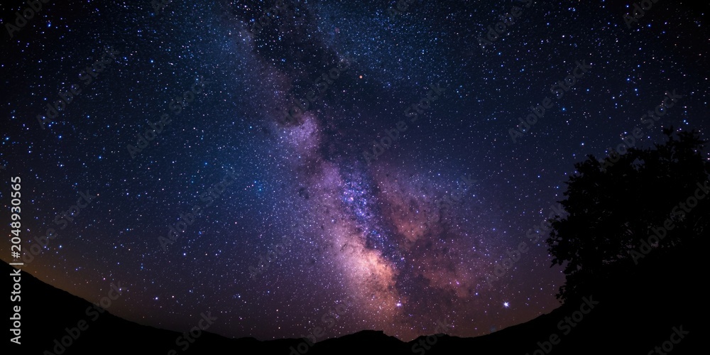 Obraz premium vivid milky way stars shining bright in a pitch black night
