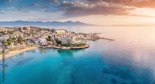 Photos Kusadasi resort town on the Aegean Sea coastline, featuring a sandy beach, build