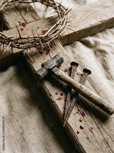 Symbolic representation of sacrifice crown of thorns and hammer on cross