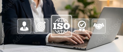 Businesswoman working on a laptop with iso certification icons displayed in the foreground.
